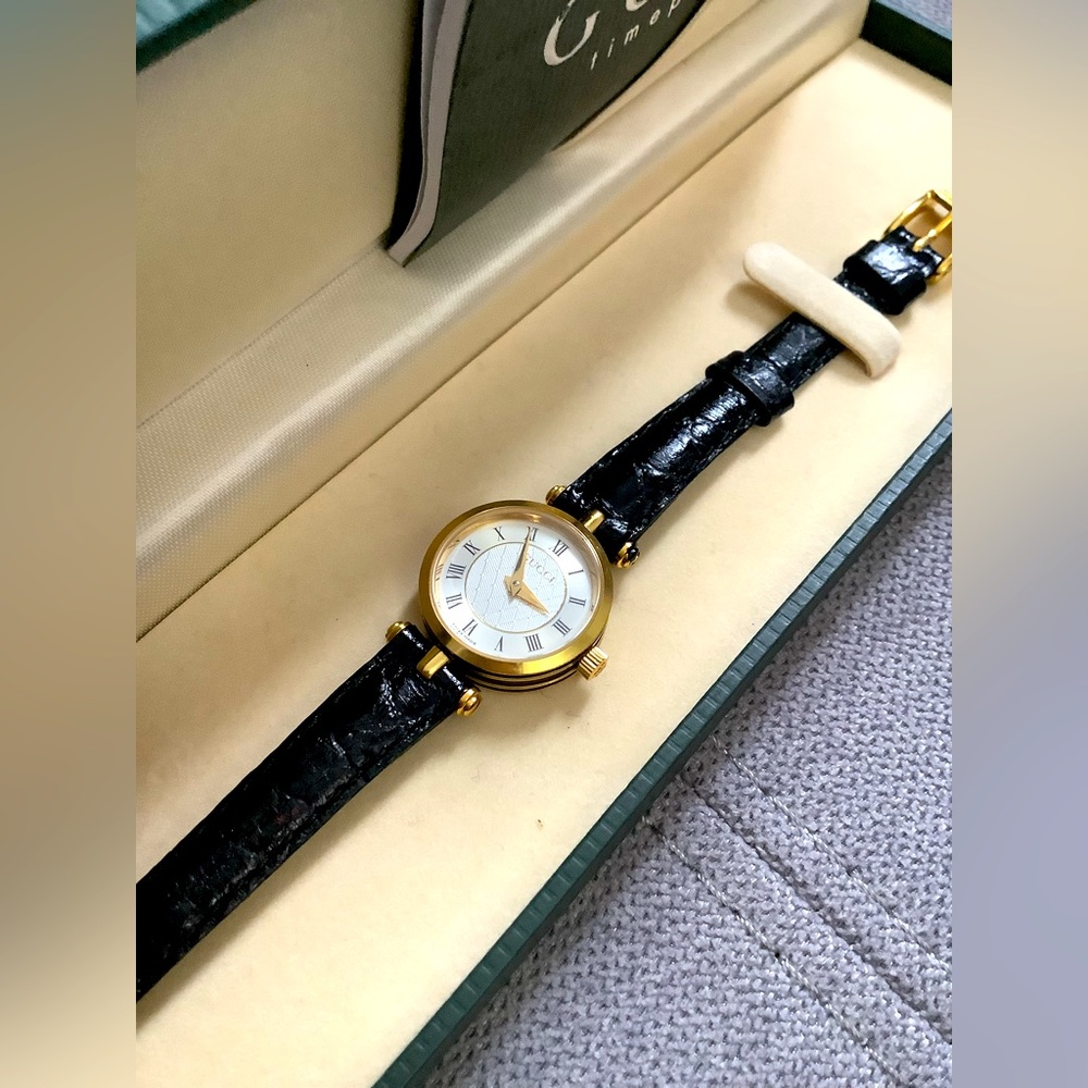 Gucci Gold and Black Leather Women's Round Dial Watch